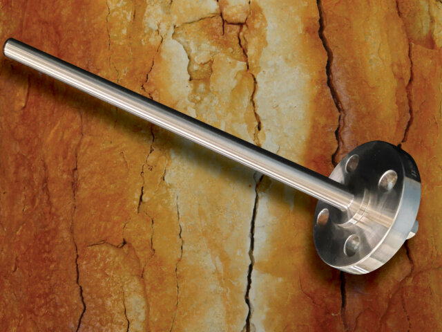 a photo of a thermowell on a corrosion background